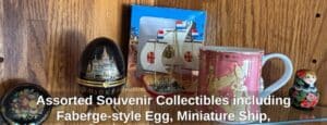 Assorted-Souvenir-Collectibles-including-Faberge-style-Egg-Miniature-Ship-Egyptian-Mug-Matryoshka-Doll-Cologne-Cathedral-Tin-and-Camel-Figurine