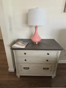 Nightstand-and-Pink-Ceramic-Table-Lamp-with-White-Drum-Shade