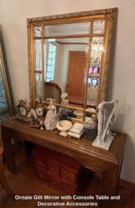 Ornate-Gilt-Mirror-with-Console-Table-and-Decorative-Accessories