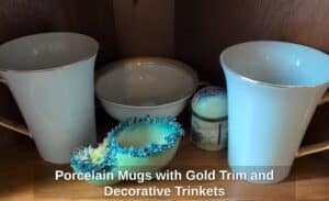 Porcelain-Mugs-with-Gold-Trim-and-Decorative-Trinkets