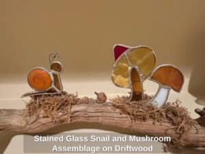 Stained-Glass-Snail-and-Mushroom-Assemblage-on-Driftwood-second-image