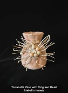 Terracotta-Vase-with-Twig-and-Bead-Embellishments