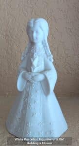 White-Porcelain-Figurine-of-a-Girl-Holding-a-Flower