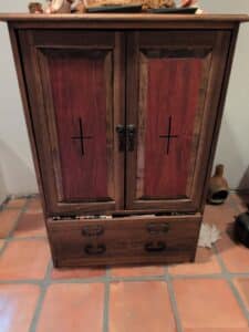 Rustic-Wooden-Armoire-with-Cross-Motif-Doors-and-Drawer
