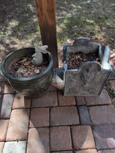 Set-of-Two-Decorative-Garden-Planters-Round-Green-Ceramic-with-Bunny-Figurine-and-Rectangular-Stone-Look-with-Urn-Relief
