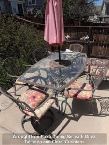 Wrought-Iron-Patio-Dining-Set-with-Glass-Tabletop-and-Floral-Cushions