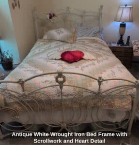 Antique-White-Wrought-Iron-Bed-Frame-with-Scrollwork-and-Heart-Detail