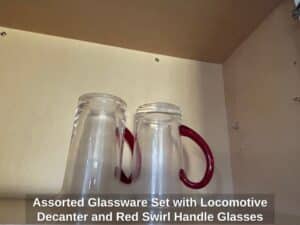Assorted-Glassware-Set-with-Locomotive-Decanter-and-Red-Swirl-Handle-Glasses-second-image