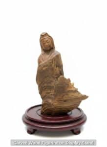 Carved-Wood-Figurine-on-Display-Stand