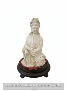 Cream-colored-Statue-of-Guanyin-on-Wooden-Base