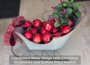 Galvanized-Metal-Sleigh-with-Christmas-Ornaments-and-Buffalo-Plaid-Ribbon