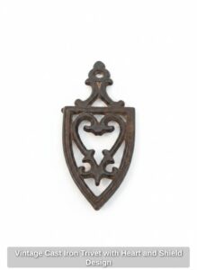 Vintage-Cast-Iron-Trivet-with-Heart-and-Shield-Design
