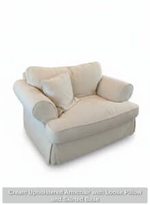 Cream-Upholstered-Armchair-with-Loose-Pillow-and-Skirted-Base