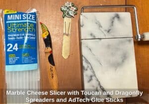 Marble-Cheese-Slicer-with-Toucan-and-Dragonfly-Spreaders-and-AdTech-Glue-Sticks