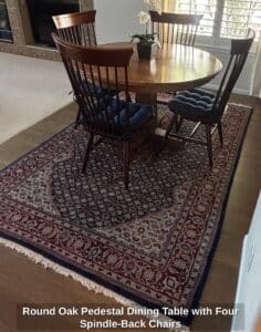 Round-Oak-Pedestal-Dining-Table-with-Four-Spindle-Back-Chairs