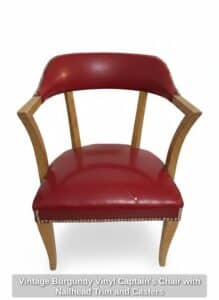 Vintage-Burgundy-Vinyl-Captains-Chair-with-Nailhead-Trim-and-Casters
