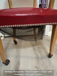 Vintage-Burgundy-Vinyl-Captains-Chair-with-Nailhead-Trim-and-Casters-third-image