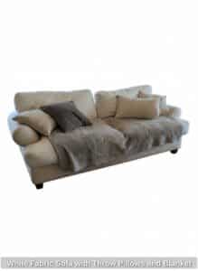 White-Fabric-Sofa-with-Throw-Pillows-and-Blanket