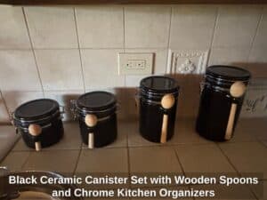 Black-Ceramic-Canister-Set-with-Wooden-Spoons-and-Chrome-Kitchen-Organizers-second-image