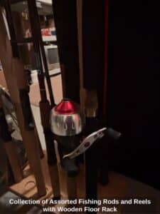 Collection-of-Assorted-Fishing-Rods-and-Reels-with-Wooden-Floor-Rack-fifth-image
