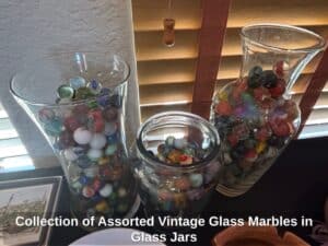 Collection-of-Assorted-Vintage-Glass-Marbles-in-Glass-Jars