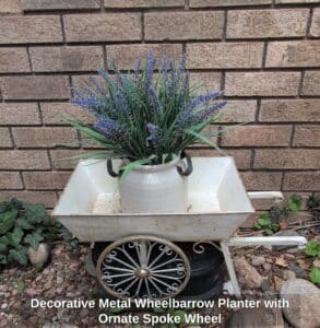 Decorative-Metal-Wheelbarrow-Planter-with-Ornate-Spoke-Wheel
