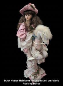 Duck-House-Heirloom-Porcelain-Doll-on-Fabric-Rocking-Horse
