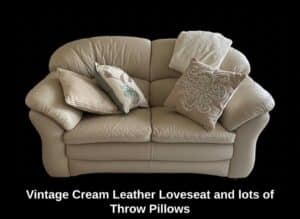 Vintage-Cream-Leather-Loveseat-and-lots-of-Throw-Pillows
