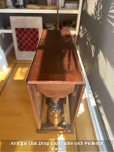 Antique-Oak-Drop-Leaf-Table-with-Pedestal-Base