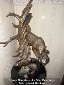 Bronze-Sculpture-of-a-Bear-Catching-a-Fish-by-Mark-Hopkins