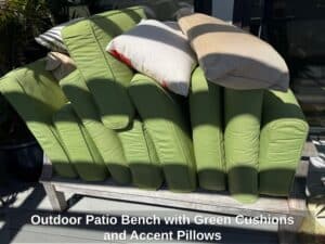 Outdoor-Patio-Bench-with-Green-Cushions-and-Accent-Pillows