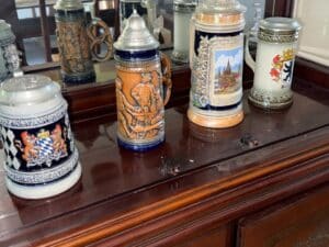 Collection-of-German-Beer-Steins-with-City-and-Heraldic-Designs