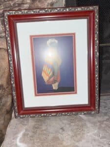 Framed-Print-of-a-Woman-with-a-Blanket-and-Pot-by-R.C.-Gorman