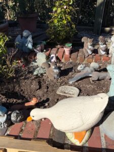 Assorted-Garden-Statuary-Collection-Rabbits-Squirrels-Gnomes-Angels-and-Girl-on-Pedestal-second-image