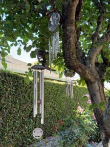 Decorative-Wind-Chimes-with-Ornate-Top-Pieces-and-Bell-Shaped-Bottom-Accent