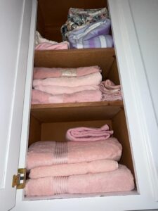 Pink-Cotton-Towels-and-Linens-with-Floral-and-Striped-Bedding