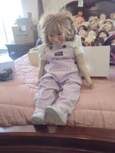 Porcelain-Doll-in-OshKosh-Bgosh-Overalls