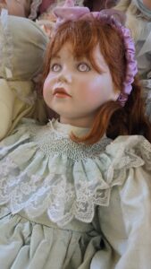 Porcelain-Doll-with-Red-Hair-and-Blue-Dress