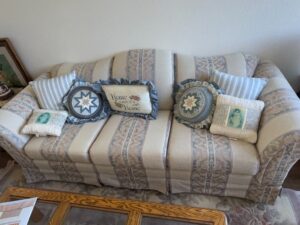 Striped-Upholstered-Sofa-with-Decorative-Pillows