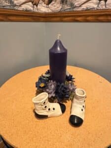 Ceramic-Boot-Planters-with-Candle-and-Floral-Wreath