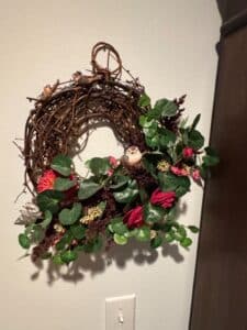 Grapevine-Wreath-with-Faux-Floral-and-Bird-Embellishments