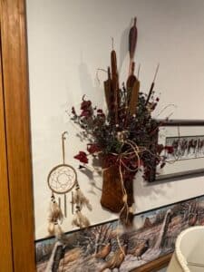 Rustic-Dried-Floral-Arrangement-with-Feathers-and-Cattails