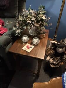 Vintage-Wooden-End-Table-with-Rooster-Coaster-and-Glass-Votive-Holders