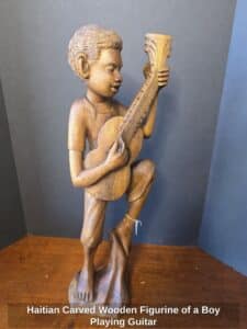 Haitian-Carved-Wooden-Figurine-of-a-Boy-Playing-Guitar