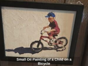 Small-Oil-Painting-of-a-Child-on-a-Bicycle