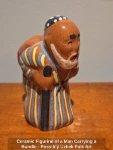 Ceramic-Figurine-of-a-Man-Carrying-a-Bundle-Possibly-Uzbek-Folk-Art