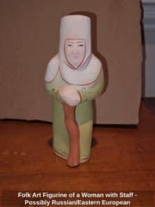 Folk-Art-Figurine-of-a-Woman-with-Staff-Possibly-Russian-or-Eastern-European