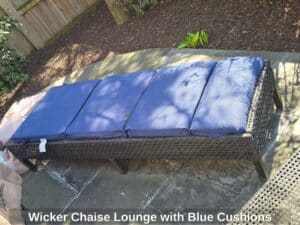 Wicker-Chaise-Lounge-with-Blue-Cushions
