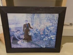 Claude-Monet-Camille-Monet-and-a-Child-in-the-Artists-Garden-at-Argenteuil-Framed-Print