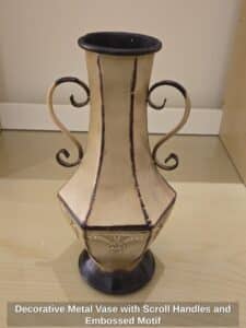 Decorative-Metal-Vase-with-Scroll-Handles-and-Embossed-Motif